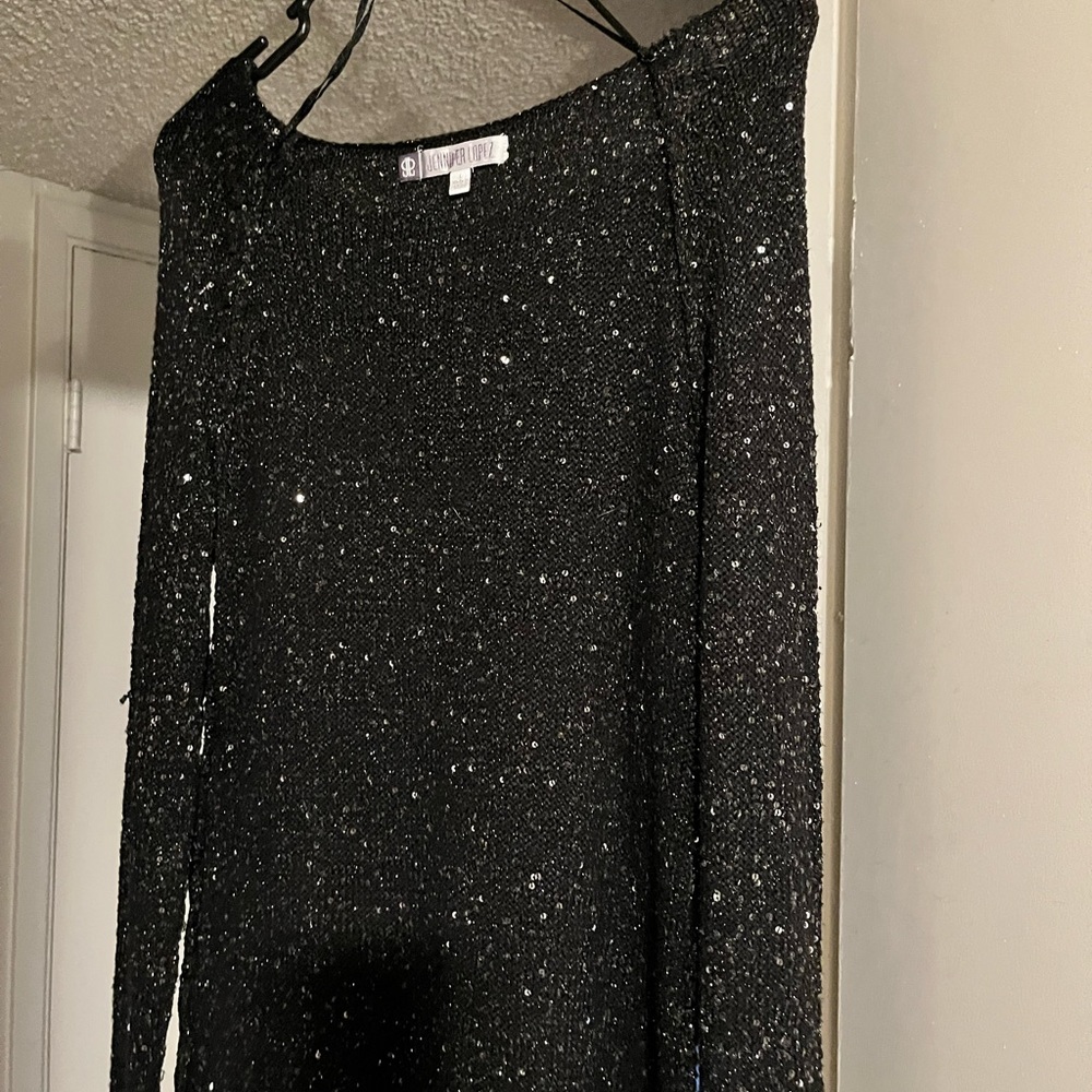 A Jennifer López very glittery sweater light weight.